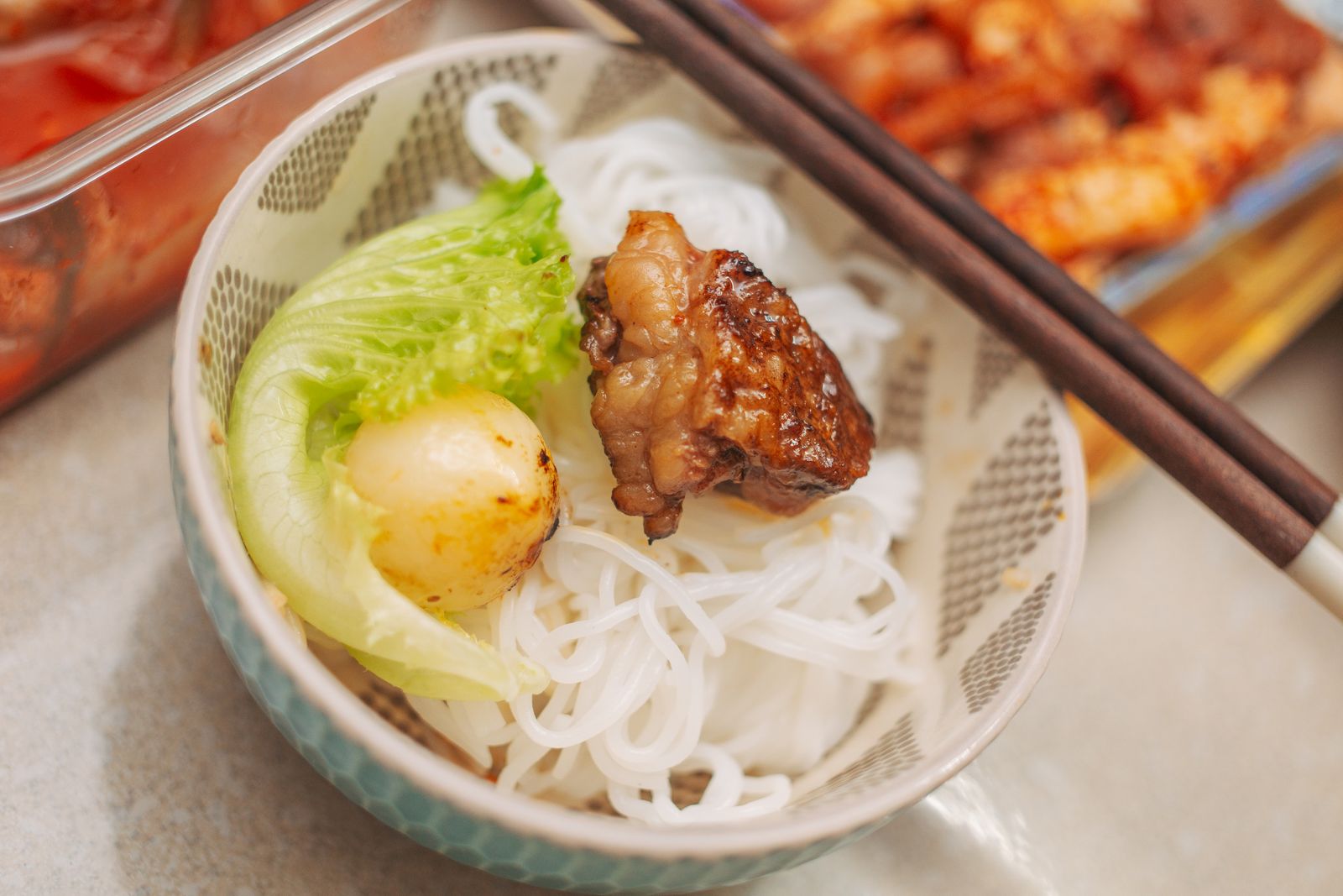 Bún chả bowl with grilled pork, noodles and lettuce